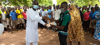 Dr Bright Bakye Yelviel Baligi making the donation