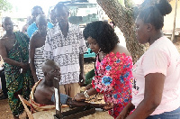 Dr. Wiafe Addai screening one of the people