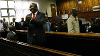 Firebrand politician Julius Malema acknowledges supporters in court