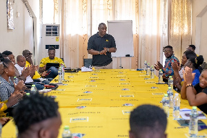 MTN employee volunteers training beneficiaries on customer service and financial literacy skills