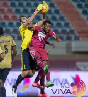 Ofori challenges Burgan goalkeeper for the ball