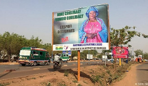 A campaign billboard on a busy street in Bamako, Mali