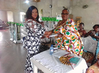 Mrs. Akasi Hormah-Miezah presented 2,000 Ghana Cedis to the people of Basake community