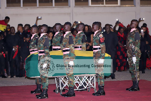 Soldiers salute the remains of the former minister