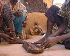 Natives playing 'ɔware'