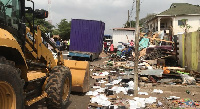 A bulldozer undertaking demolition operations