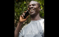 Man holding a phone. Photo: Wikimedia Commons/IanCamp