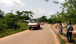 A photo of some cars on the street