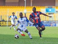 Ronald Frimpong (in white) attempts to dribble past an opponent