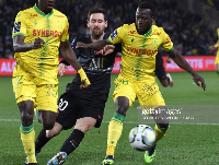 Osman Bukari intercepting a ball from Messi