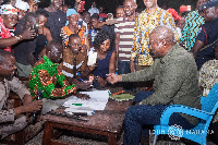 File photo: Former President John Mahama registers for the new NDC membership form