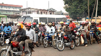 Okada riders in traffic