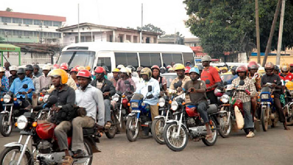 Okada riders in traffic