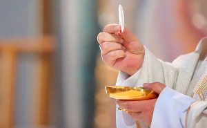 File Photo: Christians take a special bread and non alcoholic wine