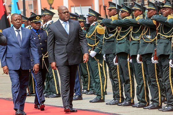 DR Congo President Felix Tshisekedi (centre) arrives to attend a regional security summit in Luanda