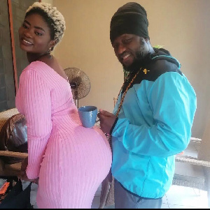 Blakk Rasta places mug on lady's buttocks