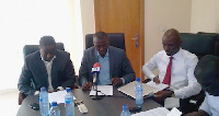 Benjamin Boakye (middle) addressing the media