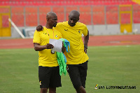 Coach Otto Addo (right) with a member of his technical team