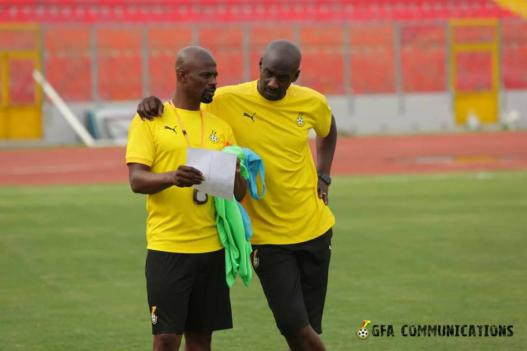 Coach Otto Addo (right) with a member of his technical team