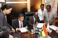 Seth Terkper, Minister of Finance signing the agr.