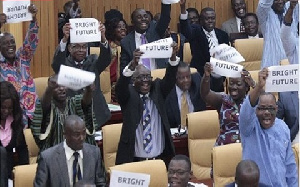 MPs holding placards during a sitting in parliament