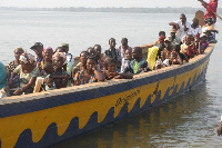 File photo of people being transported by boat