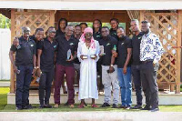 Shatta Wale in the middle holding the awards recieved by Kasapreko