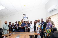 The minister with the players and some officials