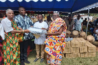 Buem MP, Kofi Adams(in smock) making a donation to the chiefs