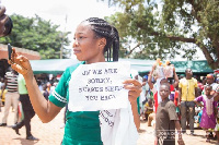 One of the nurses displaying a sheet