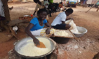 Woman engaged in small scale gari processing