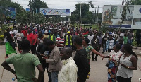 Protesters march toward the Malawi Electoral Commission office