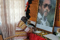 Nana Kwasi Owusu-Yeboa, Oti Regional Minister, signing the book of condolence