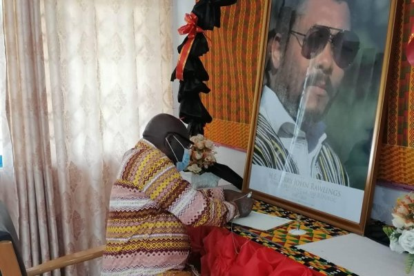 Nana Kwasi Owusu-Yeboa, Oti Regional Minister, signing the book of condolence