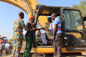 DCE Gerard Ataogye Performing The Sod Cutting.jpeg