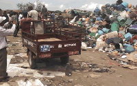 A tricycle at a dumpsite