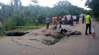 Some residents inspecting the damages on the road