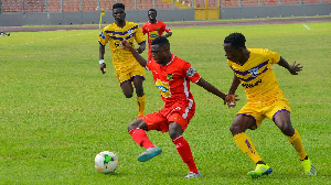 A file photo of Asante Kotoko winger Emmanuel Gyamfi against two players from Medeama S.C