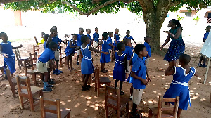 Some pupils having an interaction with their teacher