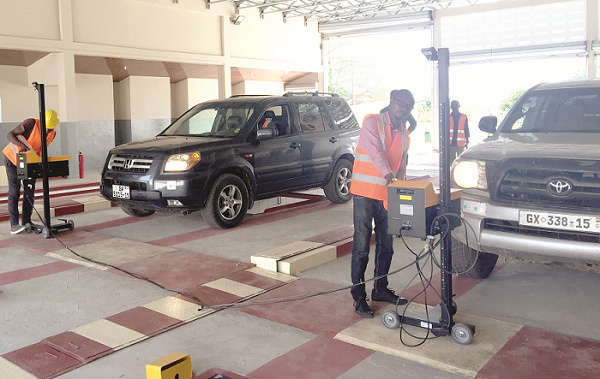 Some vehicles at a DVLA office getting checked