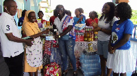 NPP Loyal Ladies presenting the items to officials of Egyam Catholic Orphanage home