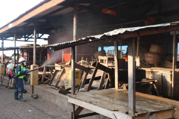 Disinfection exercise being carried out in a market