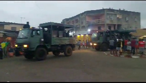 Army trucks drive drive through the streets of the capital, Libreville