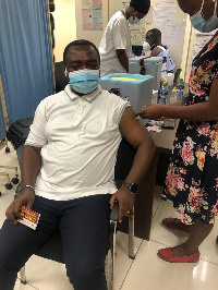 MP for Oforikrom Constituency Dr. Emmanuel Kwabena Marfo taking his jab