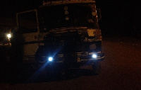 A driver using  torchlight as headlight for his truck