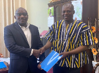 Paul Aninakwah (left) Country Director, CIMA Ghana with John G. Gatsi, Dean, UCC School of Business