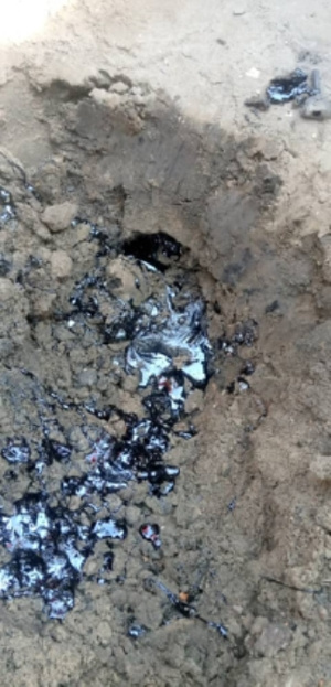 The liquid suspected to be crude oil found in the soil