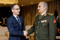 German Foreign Minister Heiko Maas shakes hands with Libya's commander Khalifa Haftar, Reuters