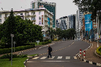 A pedestrian crosses a road in downtown Kigali, Rwanda, on March 22, 2020. PHOTO | CYRIL NDEGEYA