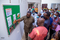 Education Minister, Dr. Adutwum, being taken around the NSS facility